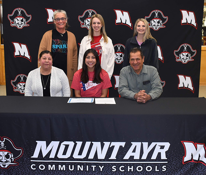 Sitting (L to R): Martina Preciado, Liliana’s mother; Liliana Aguilar; and Julian Aguilar, Liliana’s father. 
Standing: Sarah McAlexander, Mt. Ayr High School dance coach; Paige Russo, Southwestern head dance coach; and Ryann Martin, Mt. Ayr High School dance coach.
