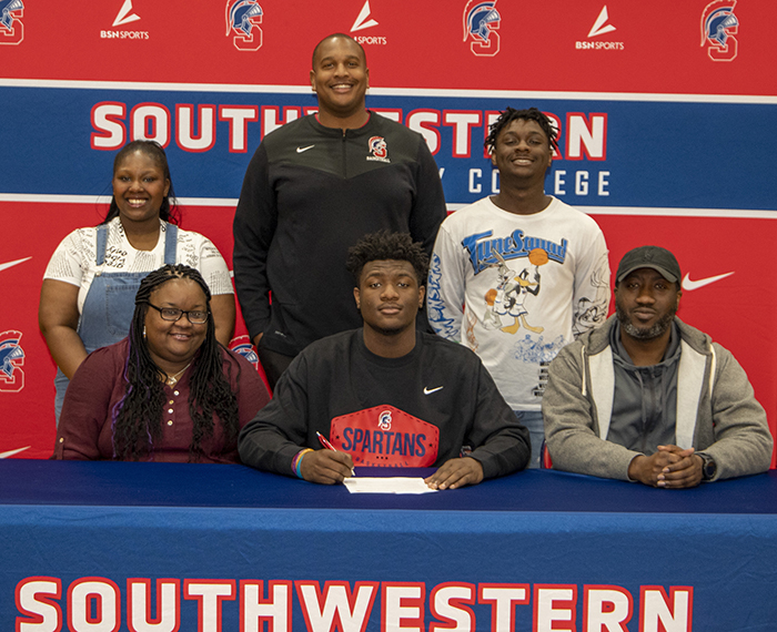 PICTURED (L to R): Front row – AunJané Rodgers, Amareion’s mother; Amareion J Doctor; and H.J. Ernest Doctor, Jr. Back row – Qiana Doctor, Amareion’s sister; Reggie Kindle, Southwestern head men’s basketball coach; and Deiondre Doctor, Amareion’s brother.