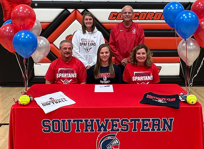 Sitting: David Streeter, Kirsten’s father; Kirsten Streeter; and Sally Streeter, Kirsten’s mother. Standing: Tessa Otto, Southwestern assistant softball coach; and Danny Jensen, Southwestern head softball coach. 