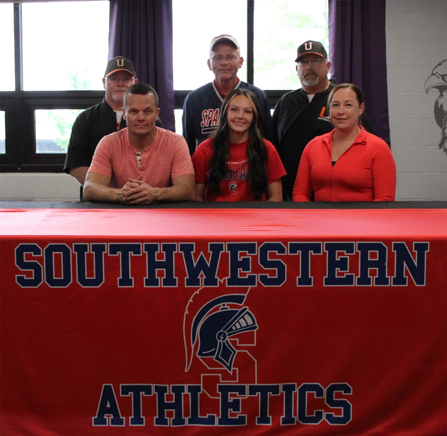 Front row – Luke Shepard, Madison’s father; Madison Shepard; and Samantha Shepard, Madison’s mother. 
Back row – Alvin Metcalf, Uniontown High School assistant softball coach; Danny Jensen, Southwestern head softball coach; and William Hathaway, Uniontown High School head softball coach.