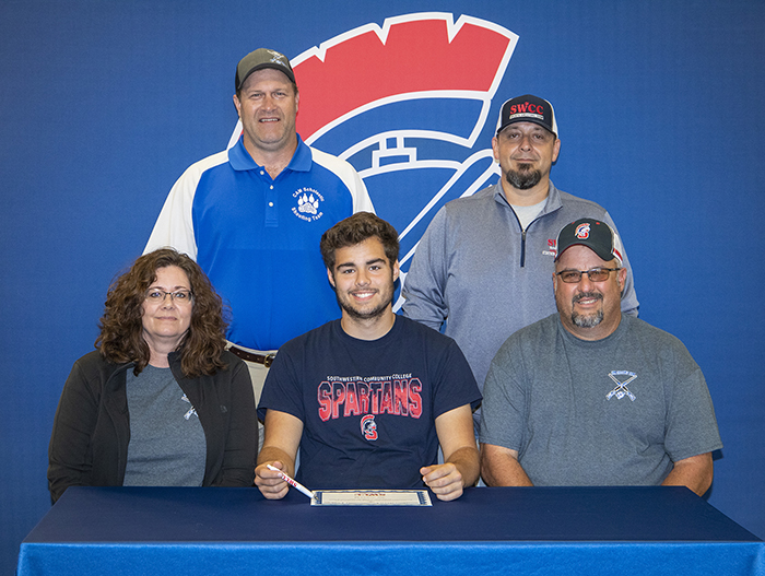 Sitting (L to R): Jolene, Joseph, and Todd Sonntag.
Standing: Chuck Kinzie, high school coach, and Josh Purdy, Southwestern head sports shooting coach.
