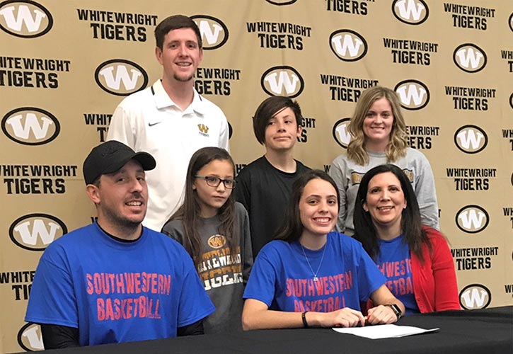 In photo: Front row - Michael Willis, Kayela&rsquo;s father; Alyssa Willis, Kayela&rsquo;s sister; Kayela Willis; and Niki Willis, Kayela&rsquo;s mother. Back row - Blaze Blain, Whitewright High School head basketball coach; Trevor Willis, Kayela&rsquo;s brother; and Keylee Blain, Whitewright High School assistant basketball coach.