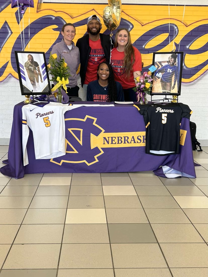 Left to right in the back row- High School Coach Scott-Hill, Father Adewale Lawal, SWCC Coach Maitlen and front center recruit Skyelar Lawal.
